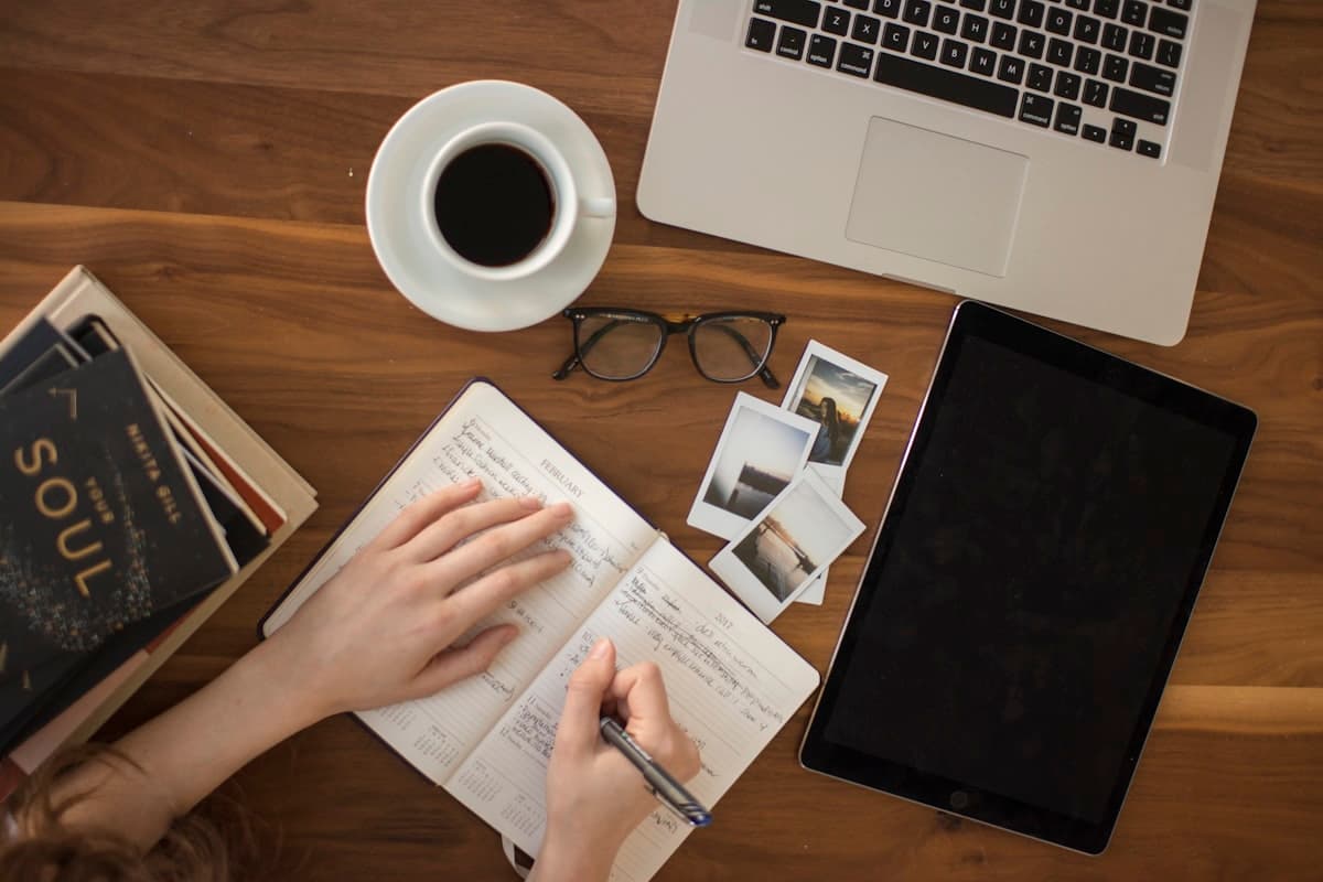 A person writing notes in a notebook