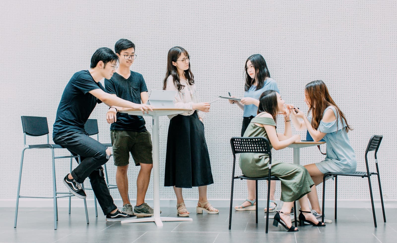 A research team in discussion around a table