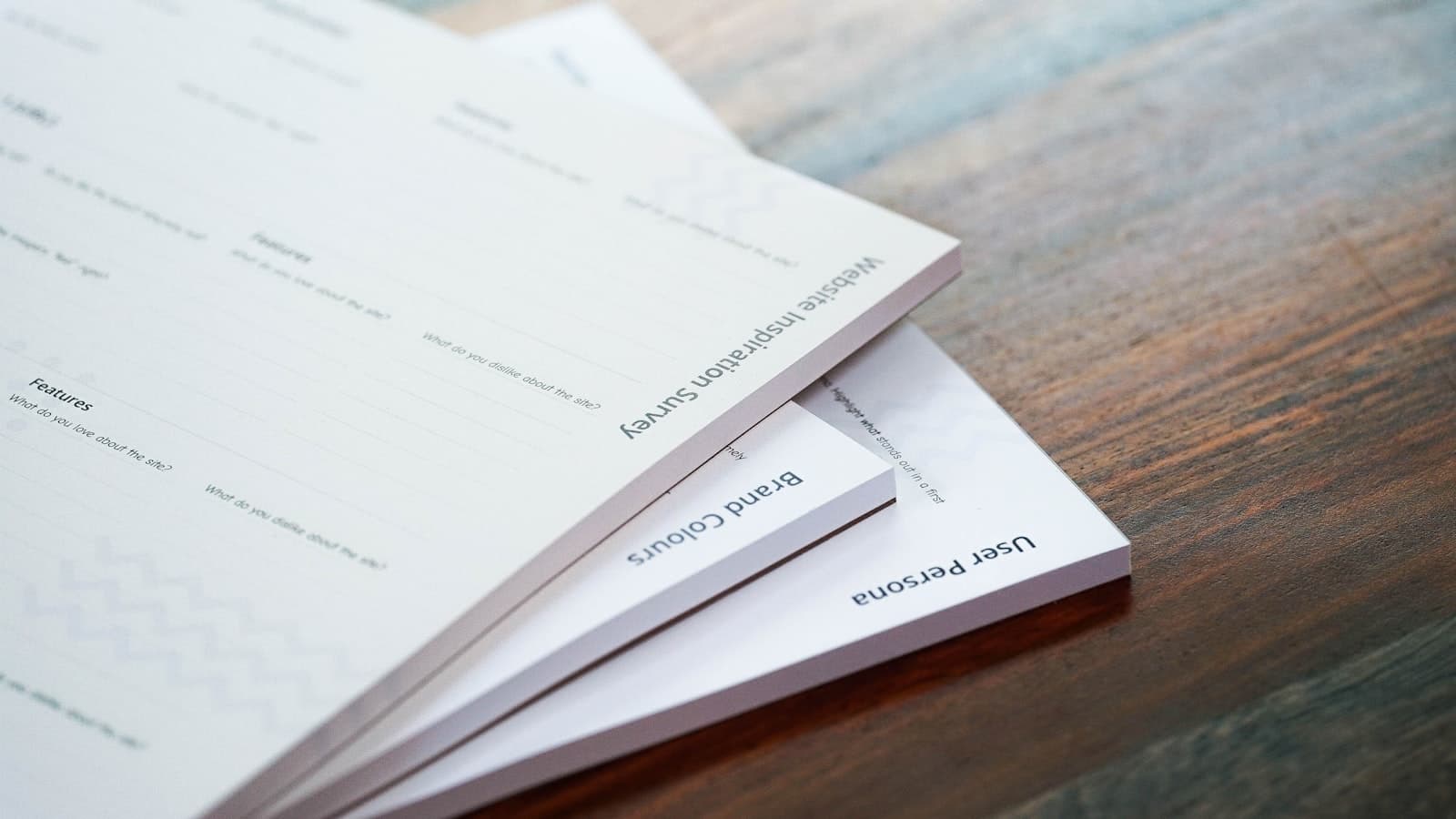 A stack of manuscript pages on a desk